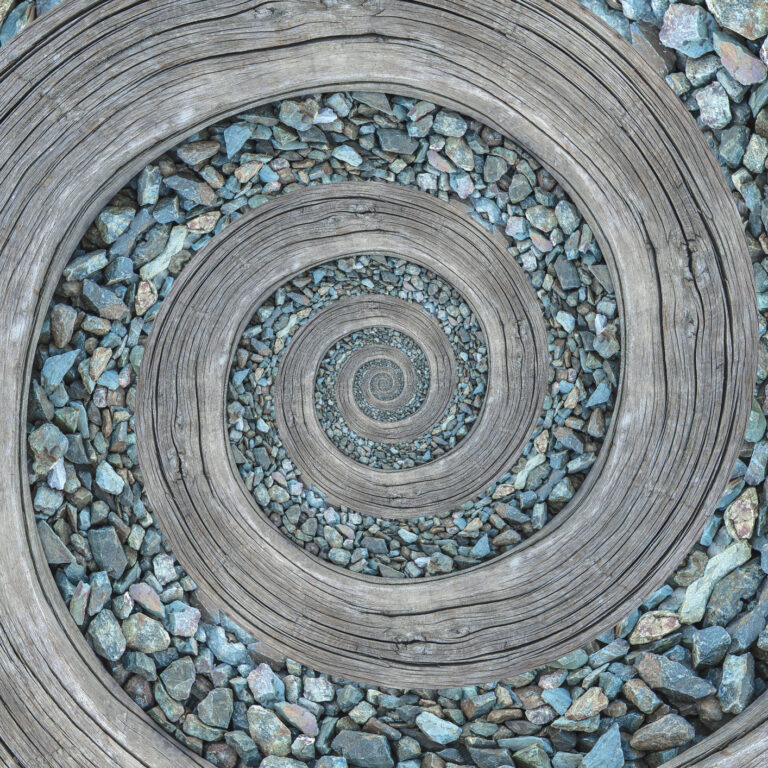 Spiral path of wood and turquoise gravel