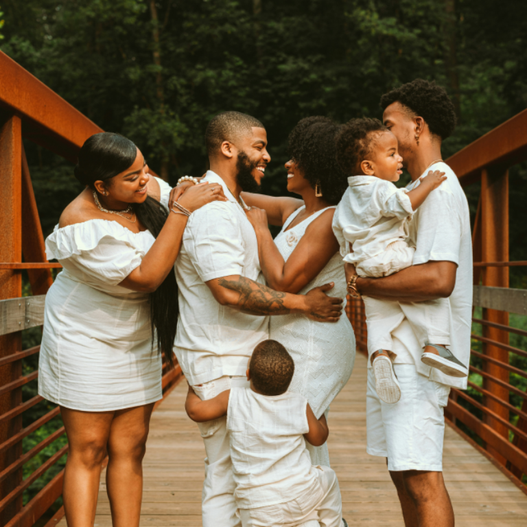 Happy multigenerational African American family photo session on bridge